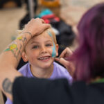 Child gets face painted