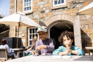 Two children tuck into ice creams