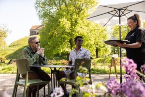 People get served a coffee outside